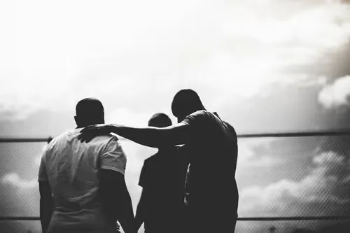 Men praying together in ministry