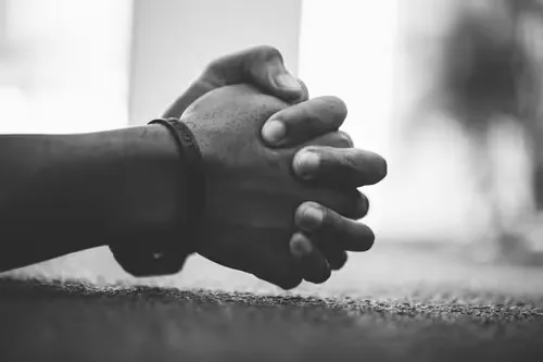 Hands folded in prayer